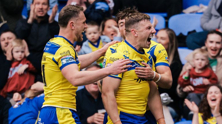 George Williams of Warrington celebrates after scoring a try.